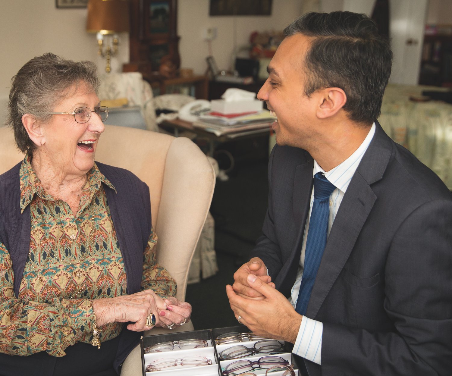 An Opticall optician visiting a patient at home in the local area