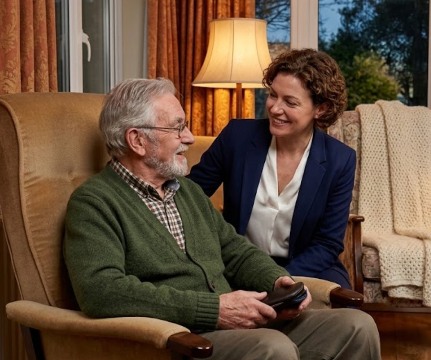 An Opticall optician gently carrying out a sight test with an older resident in an armchair
